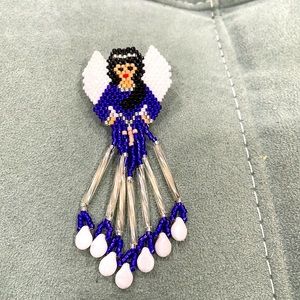 Beaded guardian angel pin.
